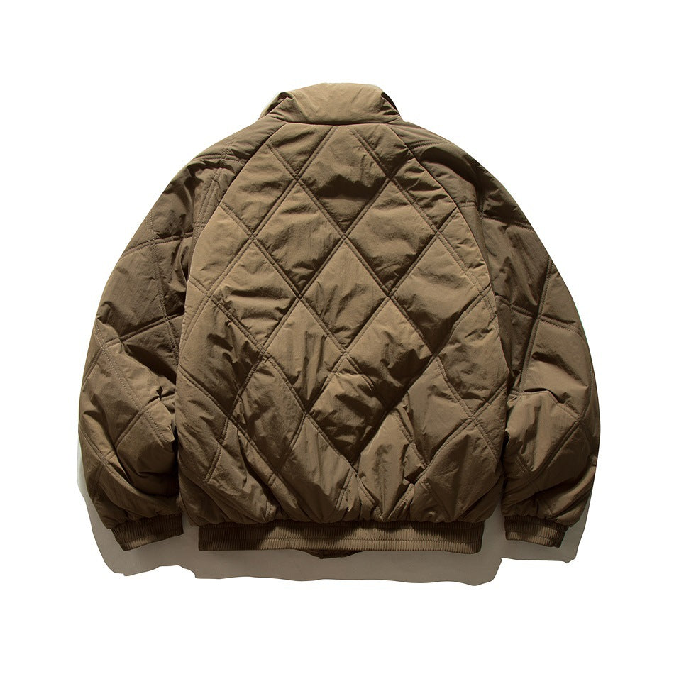 Back view of a dark brown quilted jacket with diamond stitching, a stand collar, and gathered cuffs and hem.
