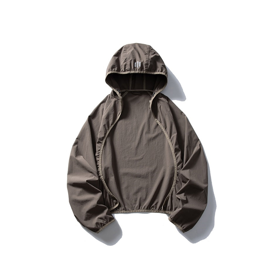 Taupe hooded jacket laid flat, open at the front, with long sleeves and three small bars on the hood.