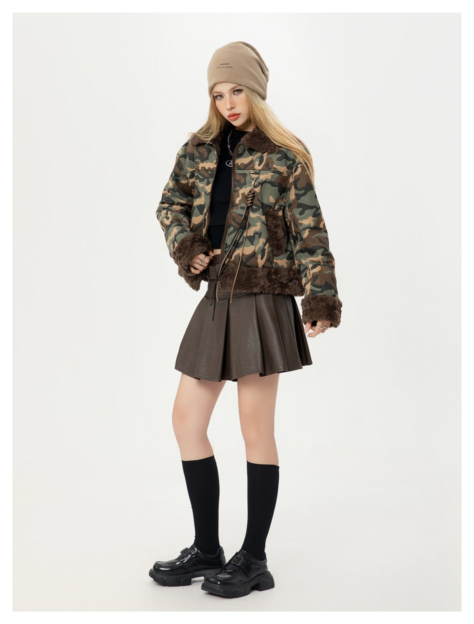Full-length model wearing a camouflage jacket with dark brown plush trim, a brown skirt and beige beanie.