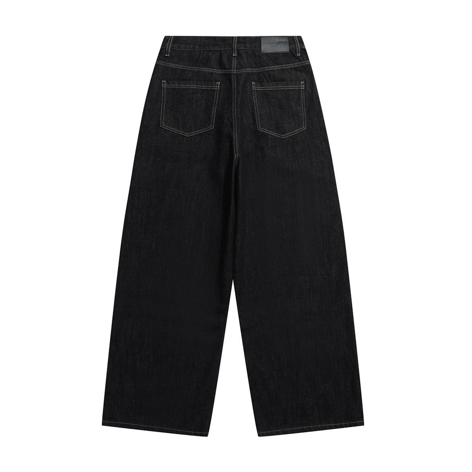 Full flat-lay view of black wide-leg jeans from the back, with two pockets and contrast stitching.