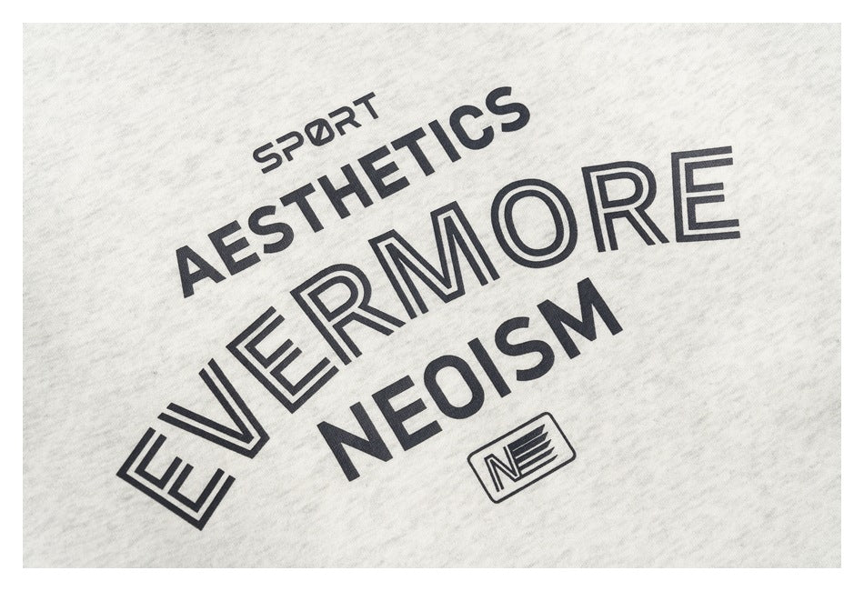 Close-up of the sweatshirt's black chest graphic on light heather gray fabric.