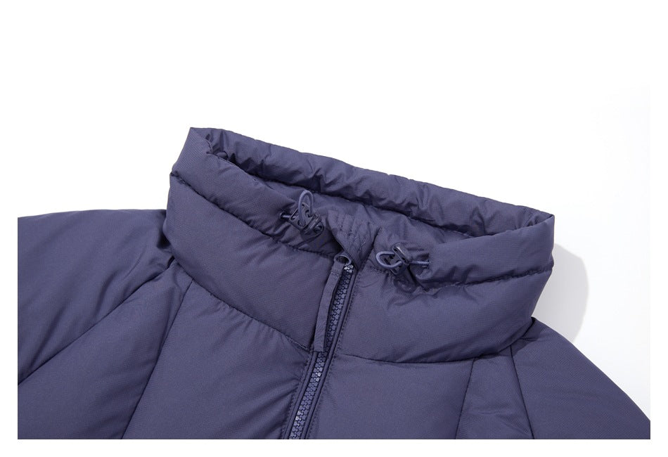 Close-up of a navy padded jacket's tall collar, front zipper, and adjustable drawcord toggles.
