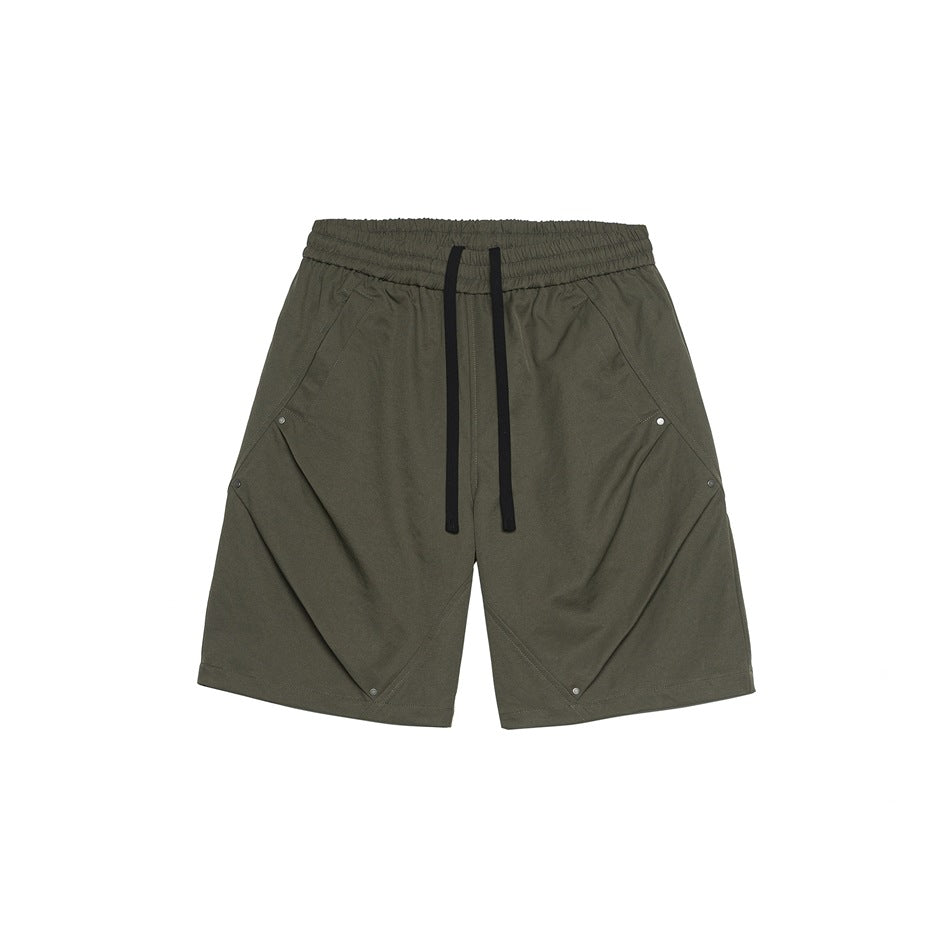 Olive gray-brown knee-length shorts, front view, with black drawstring, angled pleats and metal rivets