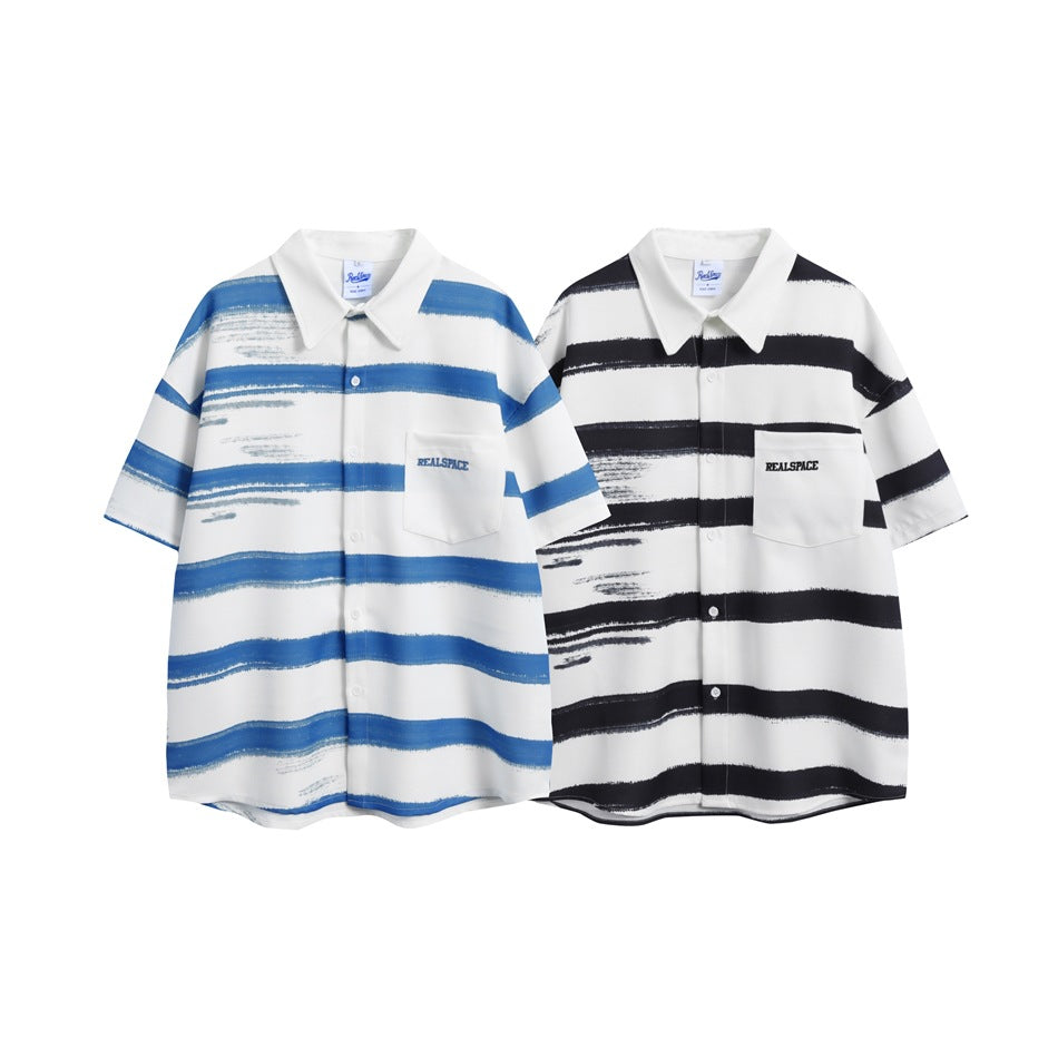 Two short-sleeve collared shirts shown flat: one white with blue brushstroke stripes and one white with black stripes.