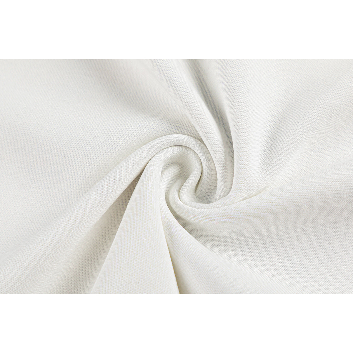 Close-up of white fabric gathered into a swirl, showing its surface texture.