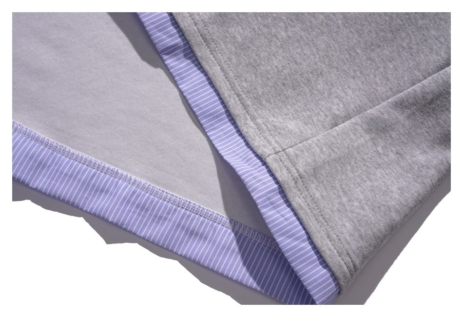 Inside close-up showing gray fabric seams and lavender striped fabric along the hem and edge.