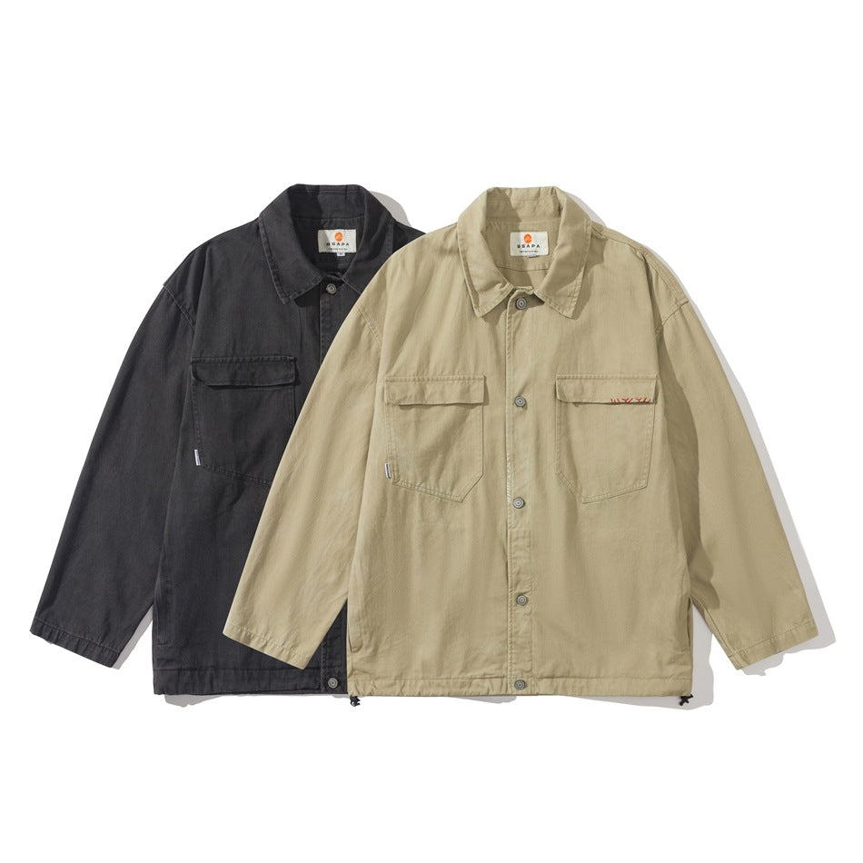 Two jackets shown from the front: one charcoal and one tan, each with a collar and two chest pockets.