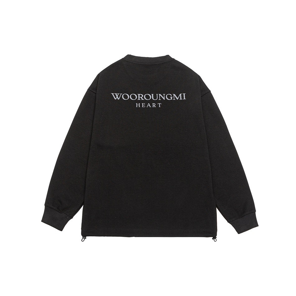 Flat back view of a black long-sleeve top with white “WOOROUNGMI HEART” lettering and adjustable hem cords.