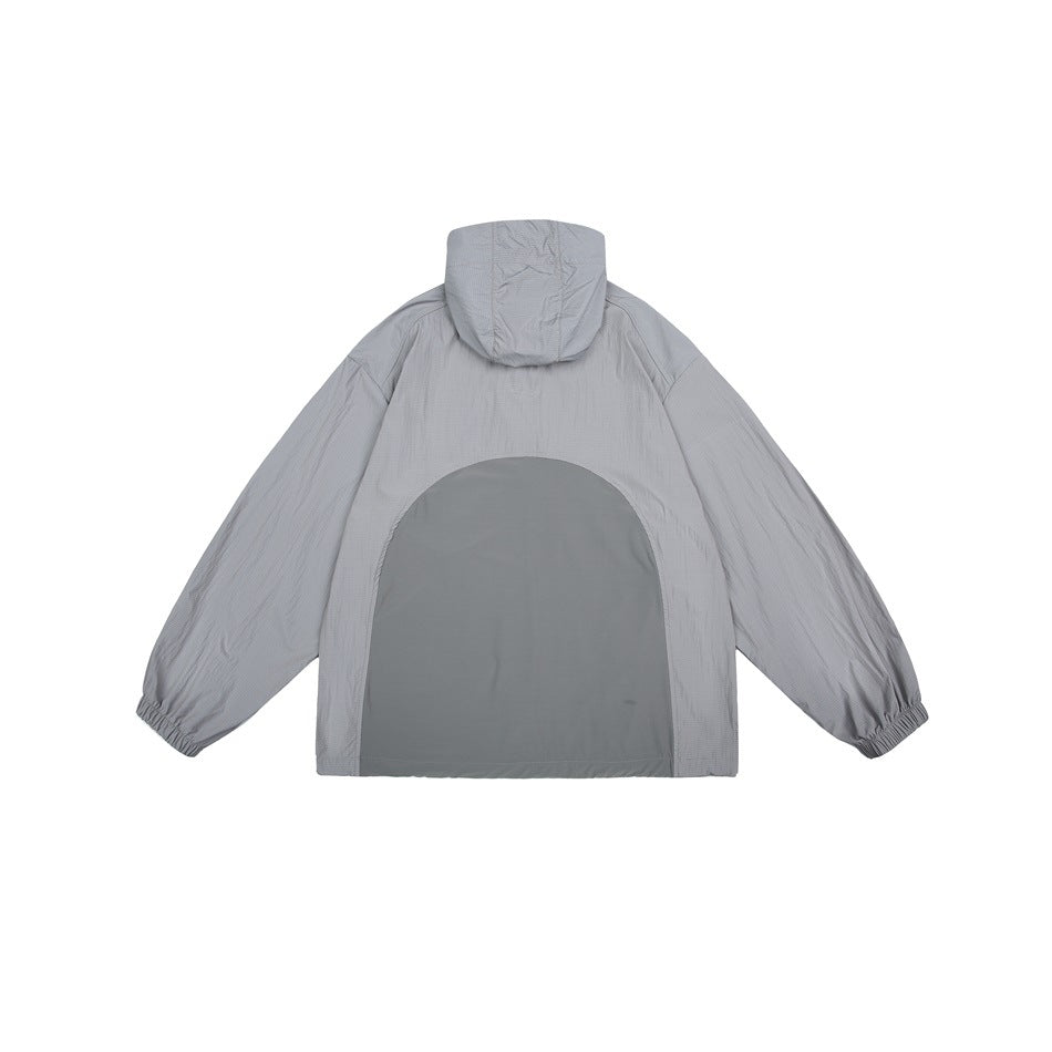 Back view of a gray hooded jacket with elastic cuffs and a large darker gray arched back panel.