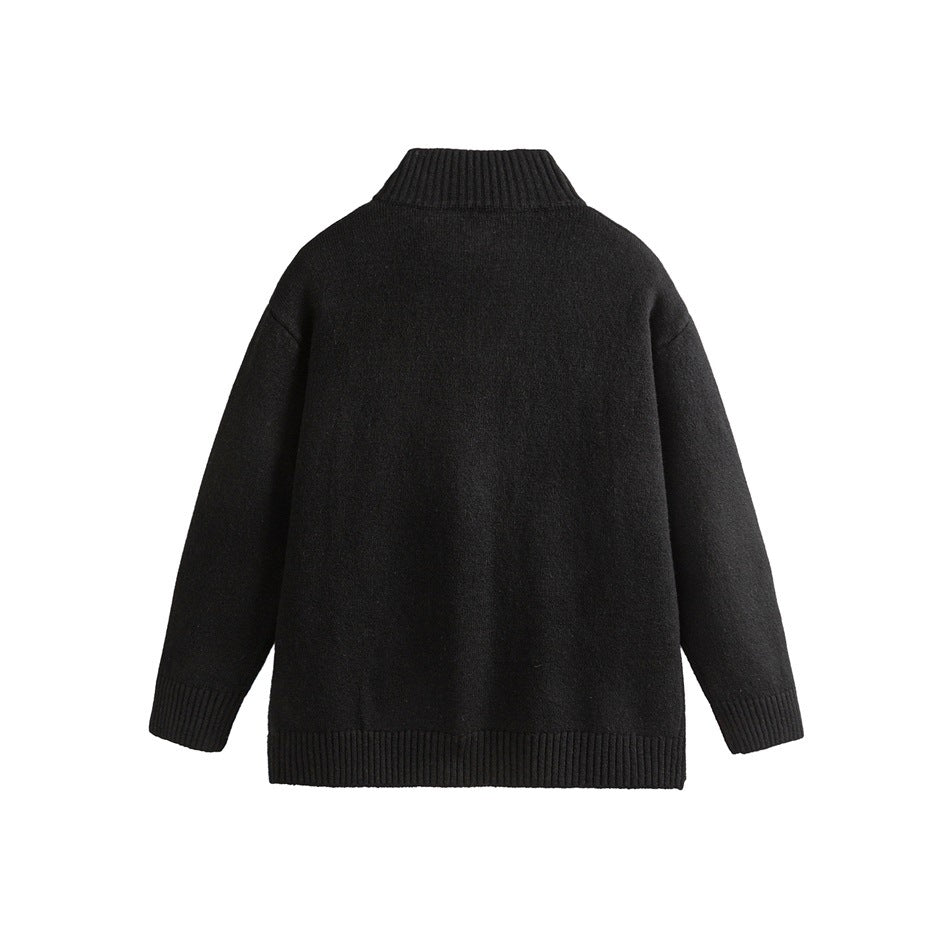 Back view of a black knit cardigan laid flat, with a ribbed stand collar, cuffs, and hem.