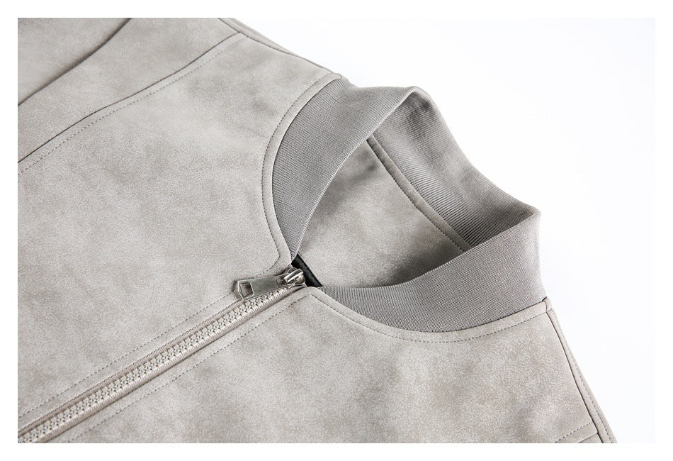 Close-up of a light gray jacket collar, ribbed neckline, stitching, and front zipper.