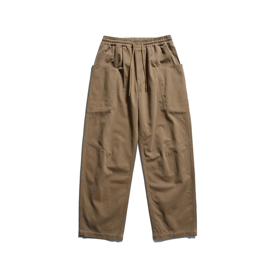 Khaki wide-leg drawstring pants with large side patch pockets, flat lay front view