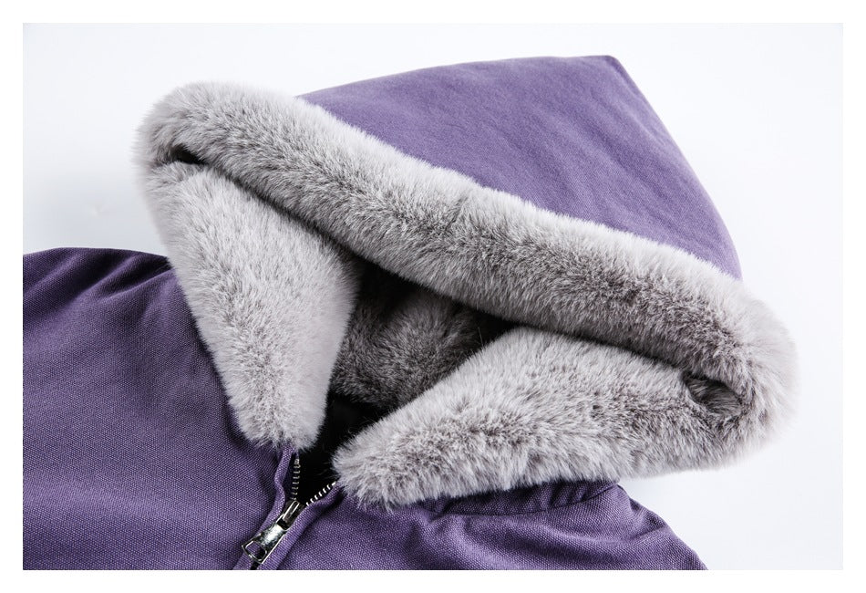 Close-up of a purple jacket hood with thick gray fur trim and part of the front zipper.