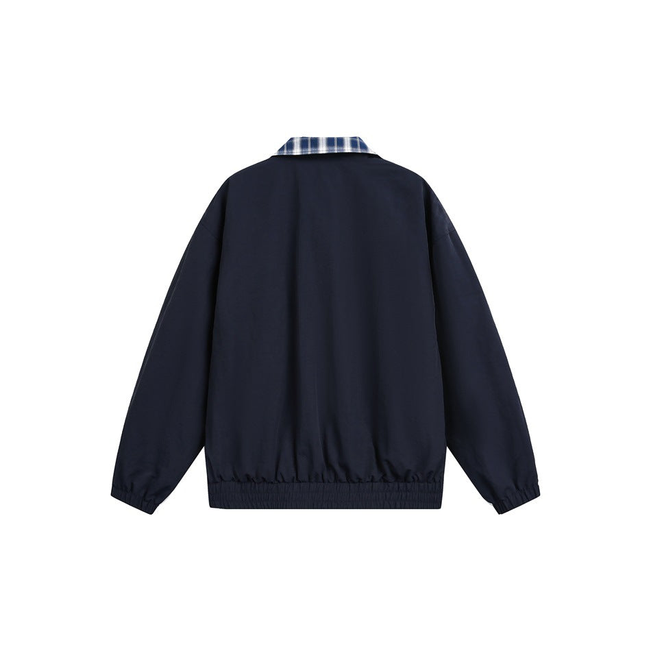 Back view of a plain navy jacket with a blue plaid collar and elastic cuffs and hem.