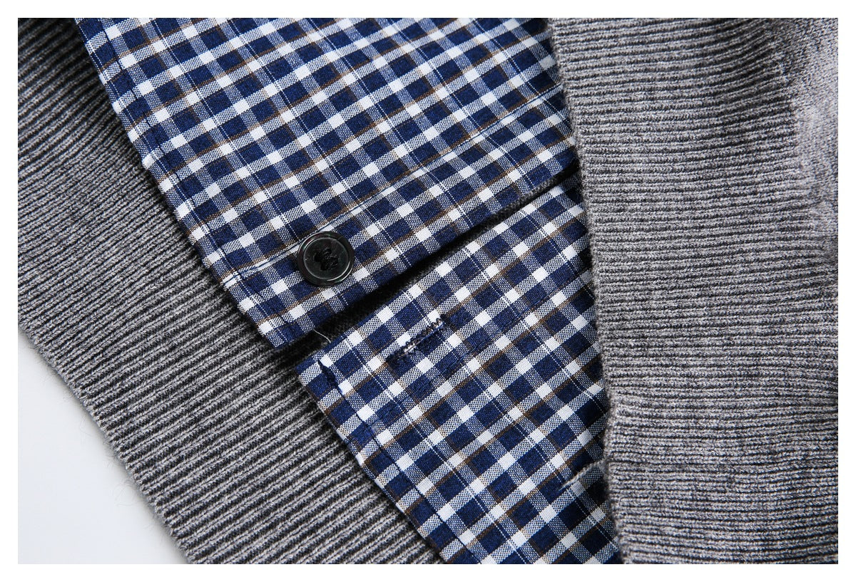 Gray rib-knit cardigan layered over a blue-and-white checked shirt, shown in close-up.