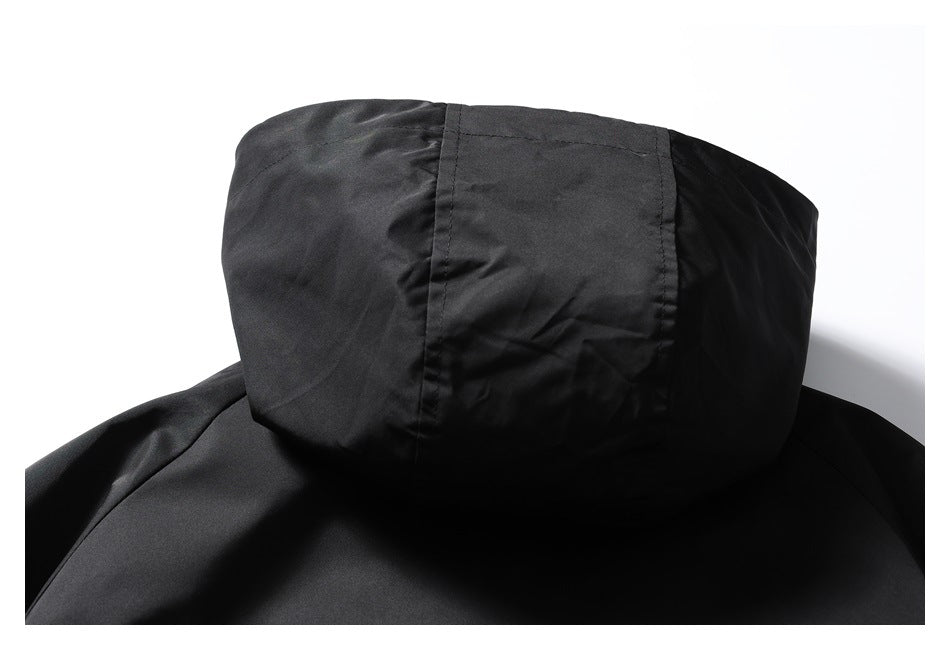 Close-up of the black jacket's hood, showing its seams and panel construction.