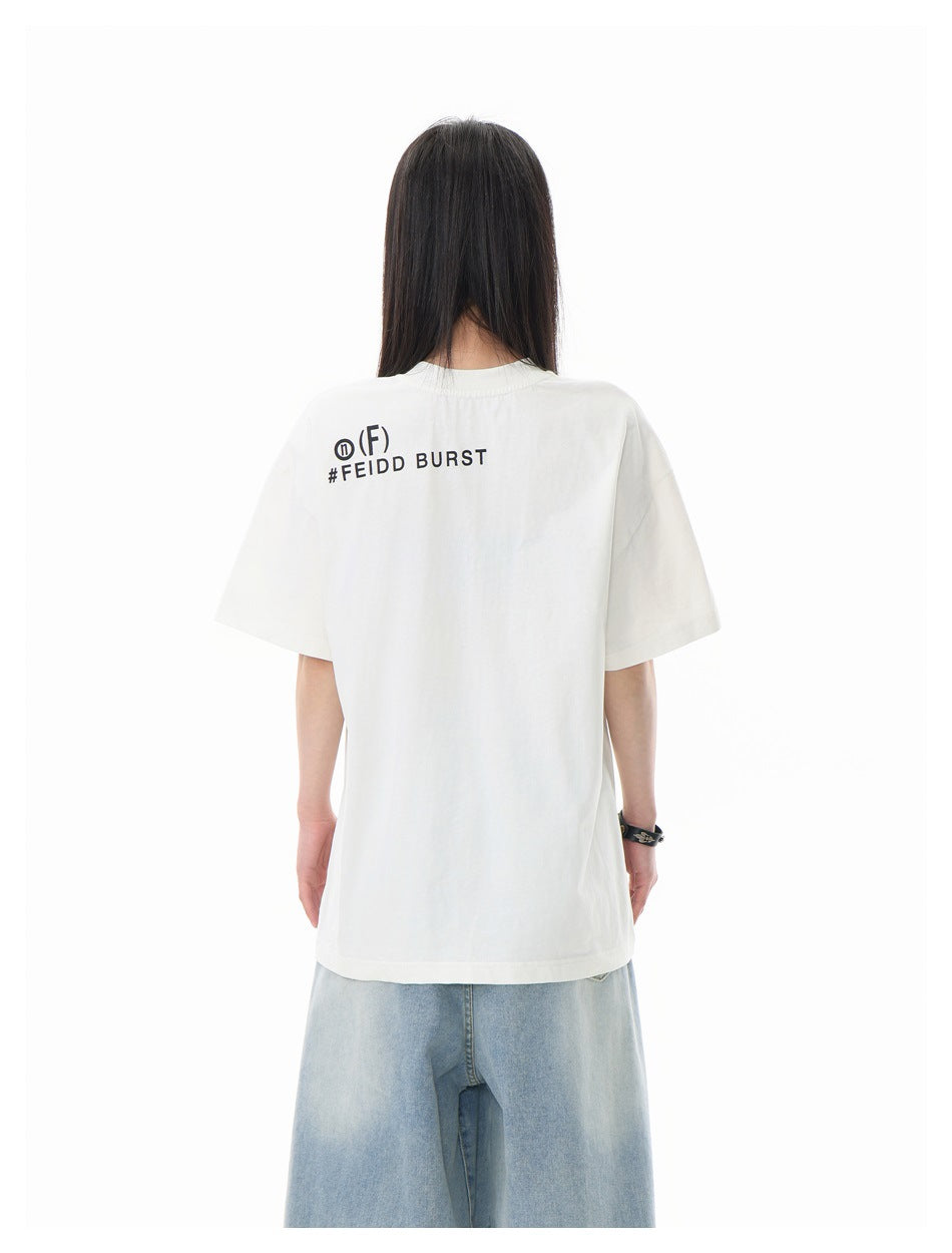 Back view of a model wearing an oversized white T-shirt with black lettering across the upper back.