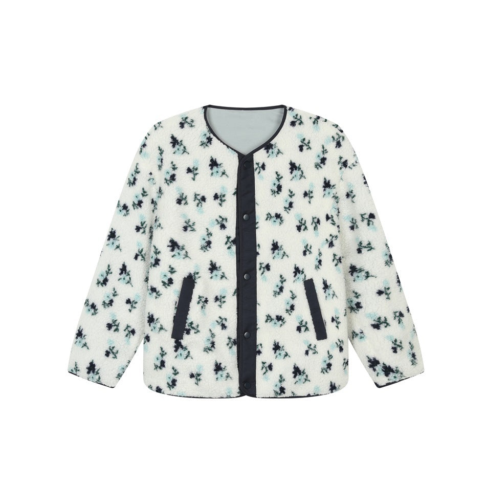White fleece-textured jacket with blue and navy floral print, navy snap front, trim and slanted pockets, flat view
