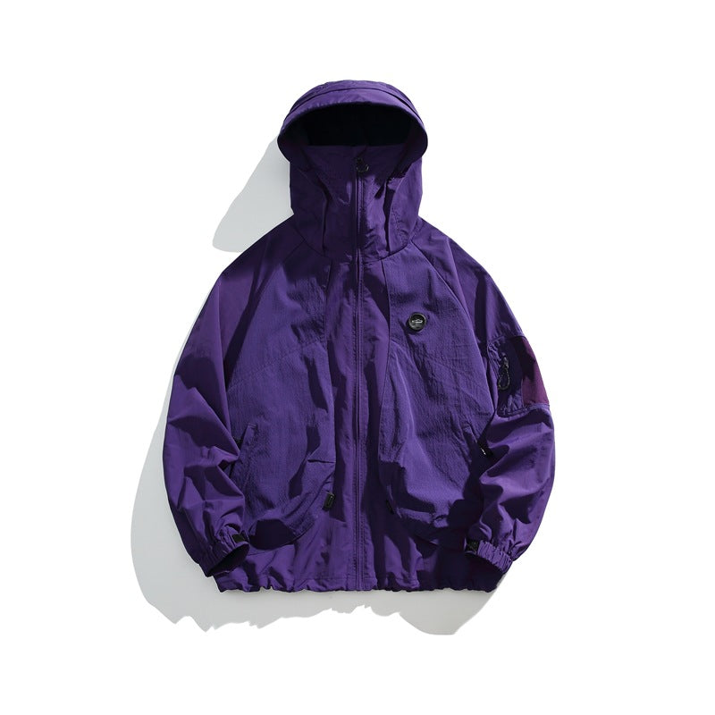 Purple hooded zip-up lightweight jacket flat lay with chest patch and sleeve pocket