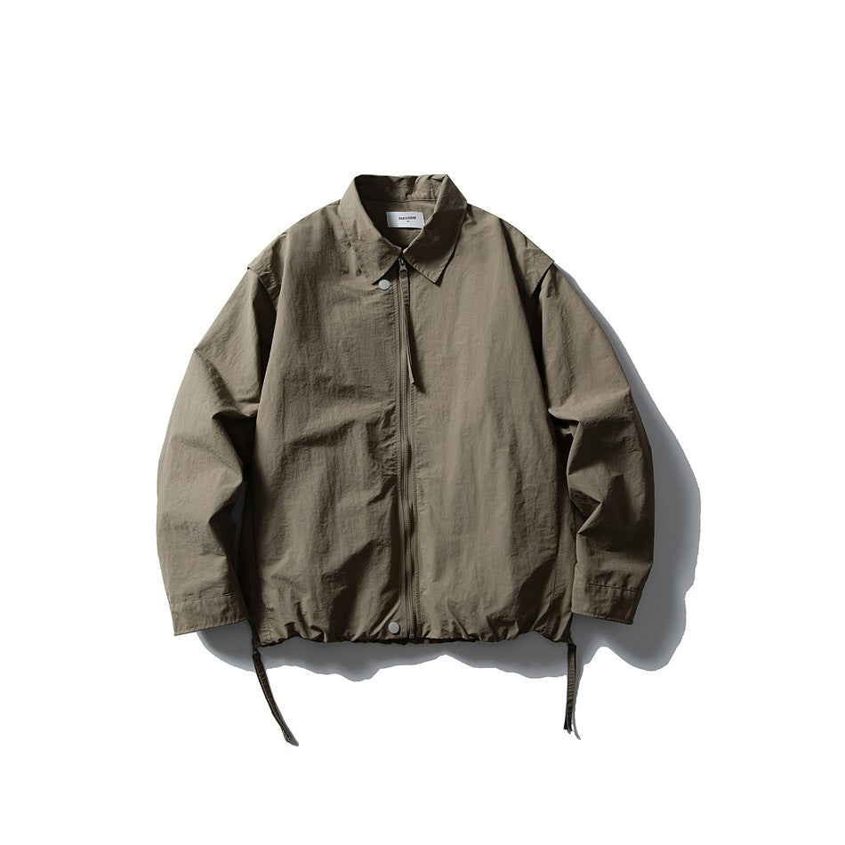 Olive green collared zip-front jacket flat lay with snap buttons, gathered hem and hanging side straps