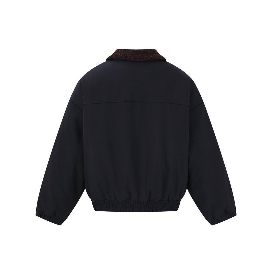 Back view of a black jacket with a dark brown collar, long sleeves, and an elasticized hem.