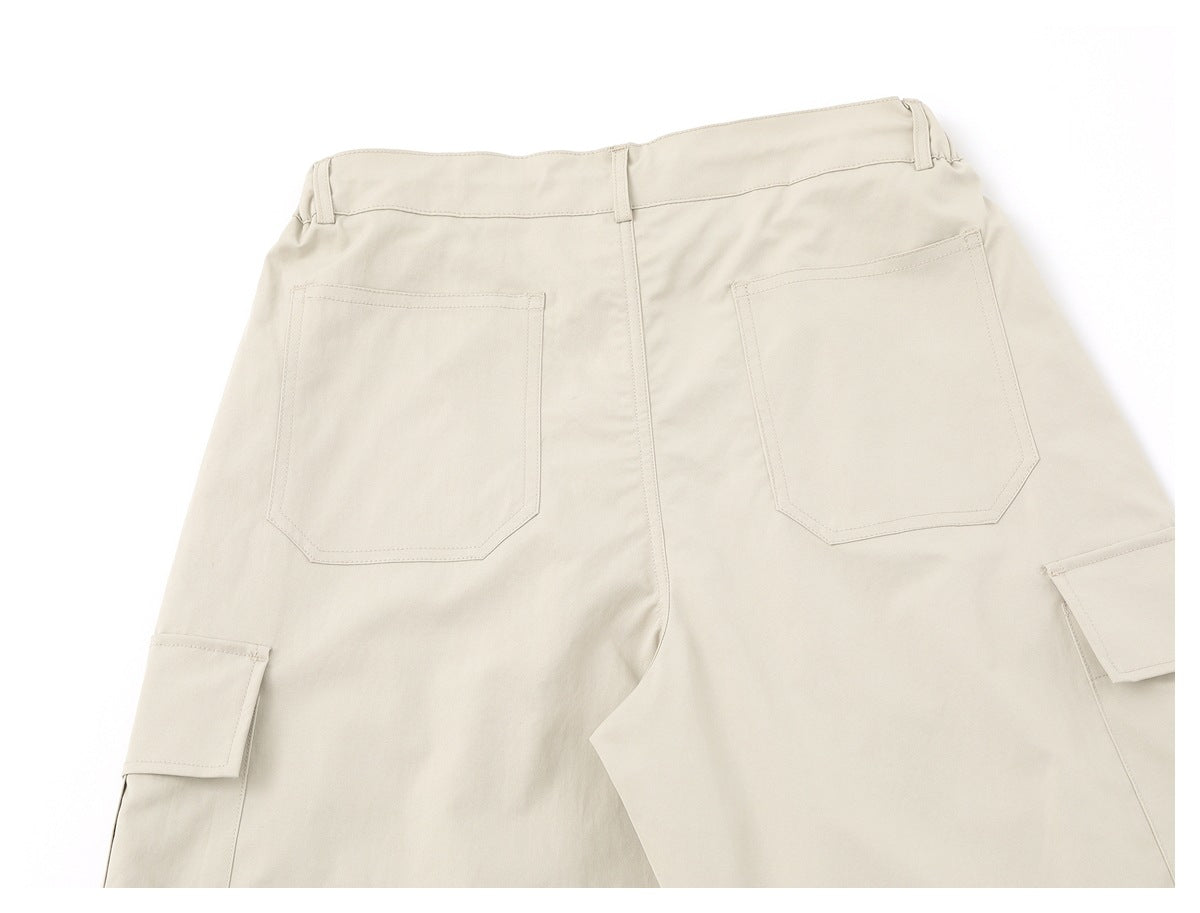 Back view of beige cargo shorts with belt loops, two rear pockets, and side cargo pockets.