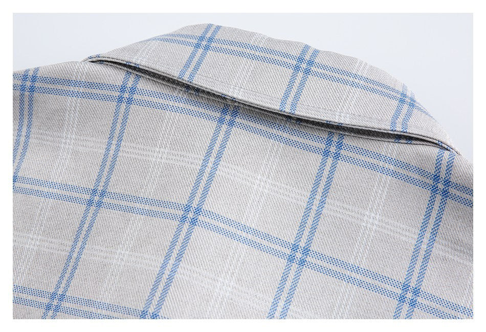 Close-up of the shirt's back collar and upper back in a light gray and blue windowpane check.