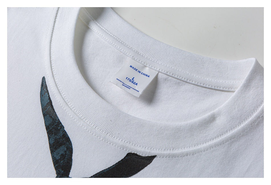 Close-up of a white T-shirt's ribbed crew neck and interior label marked Made in China and size L.