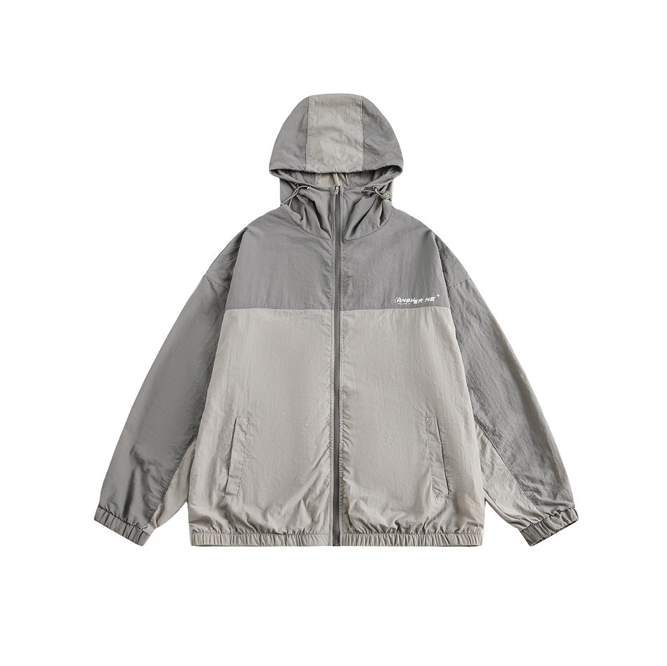 Two-tone gray hooded zip jacket with drawstring hood, elastic cuffs and hem, front pockets, flat front view