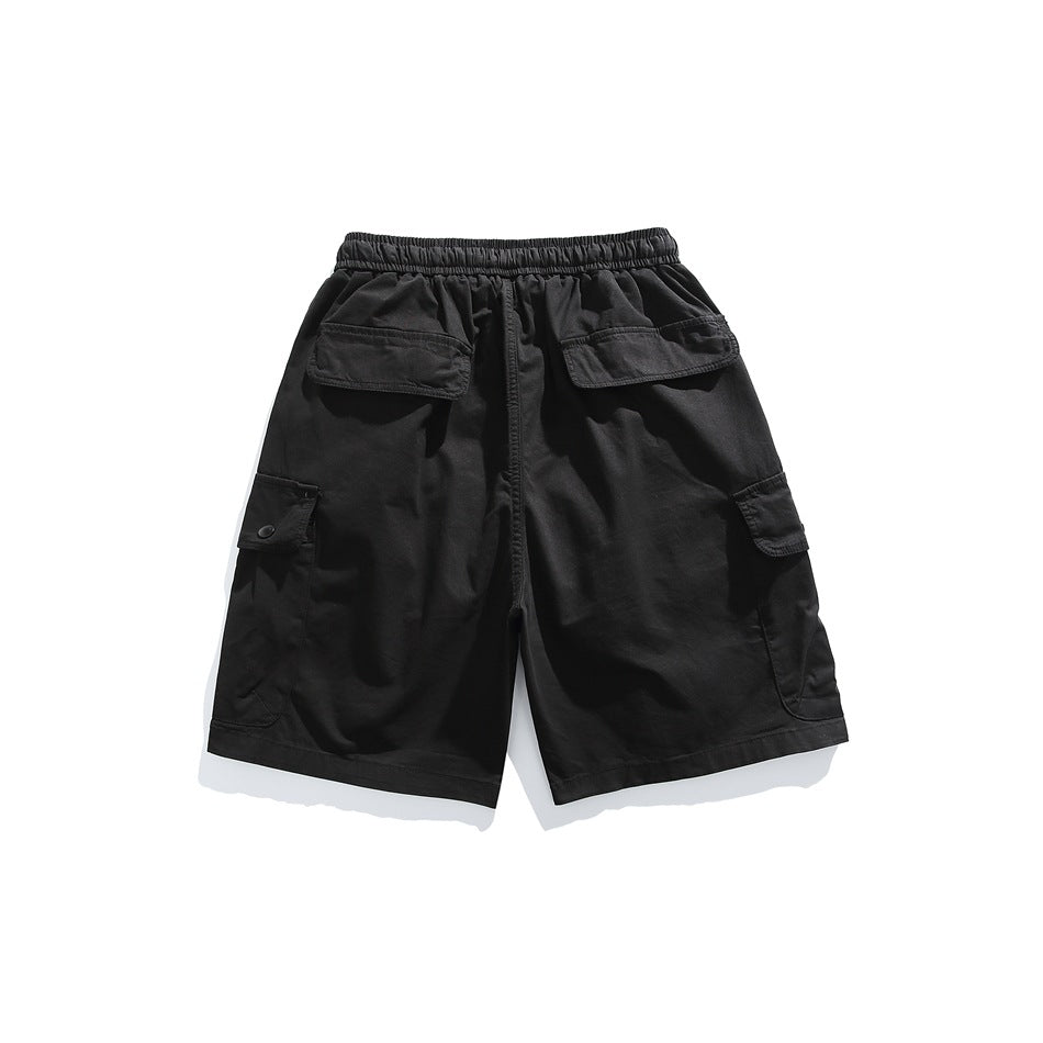 Back view of black cargo shorts with an elastic waist, two rear flap pockets, and side cargo pockets.