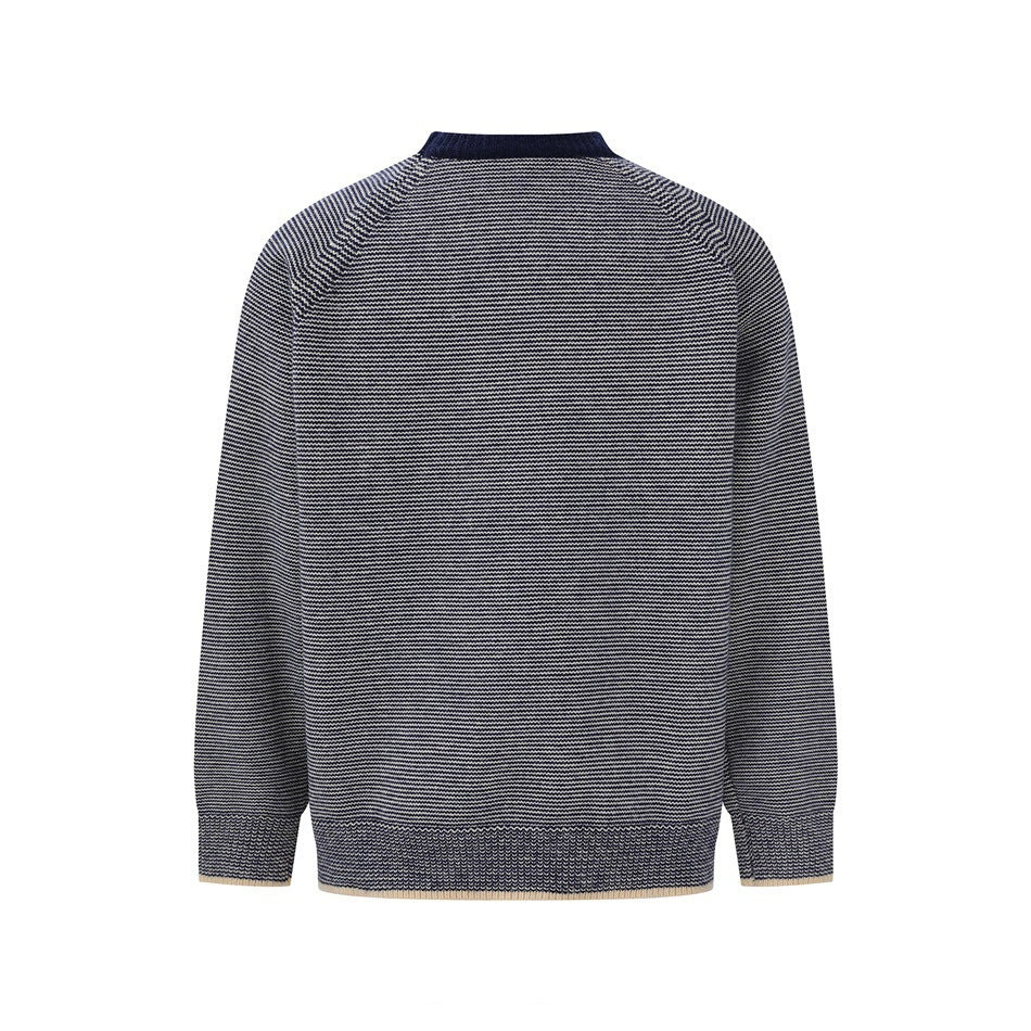 Back view of a navy and cream striped knit sweater with long sleeves, ribbed cuffs and hem, and a navy collar.