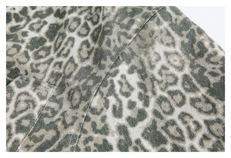Close-up of the jacket's olive and gray animal print and a curved shoulder seam.