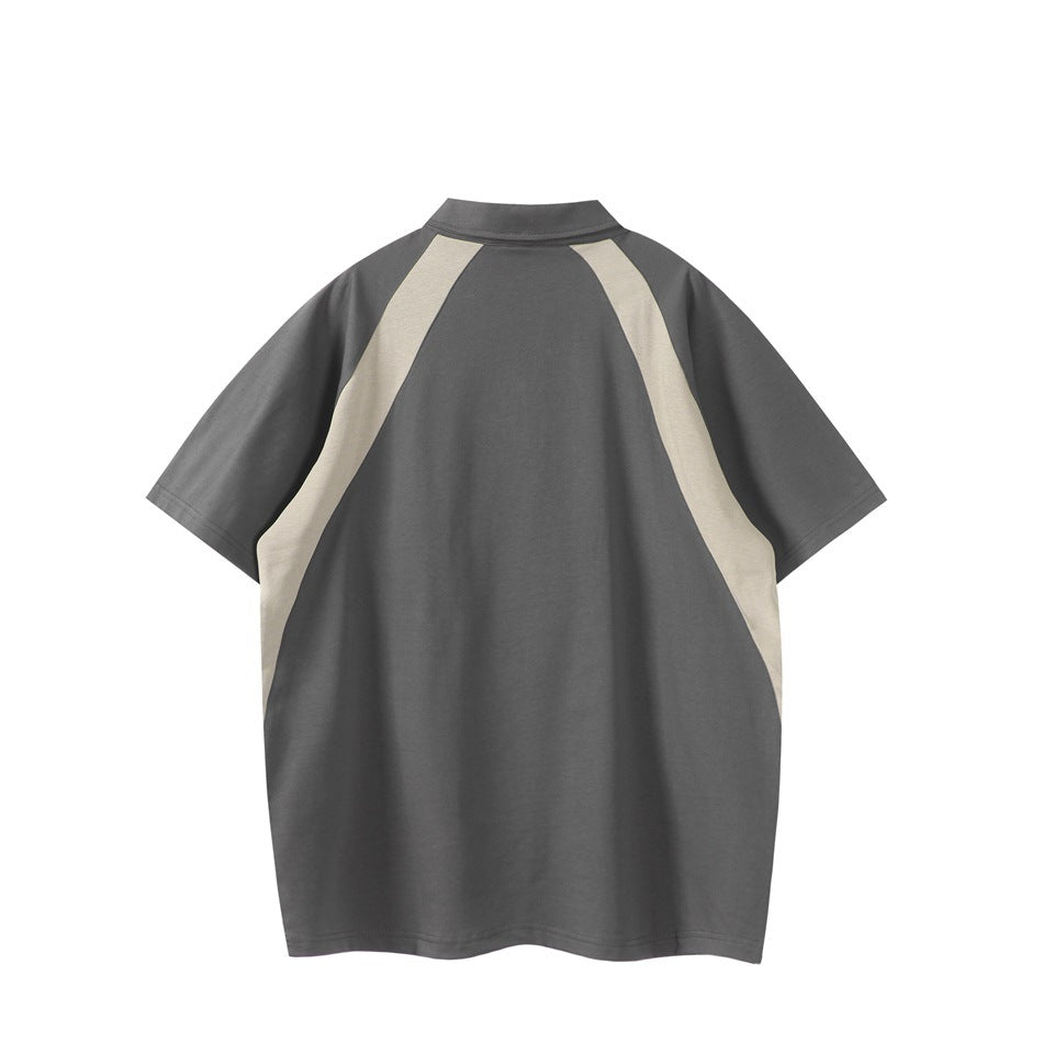 Back view of gray short-sleeve polo with beige curved panels over the shoulders and sides on white background