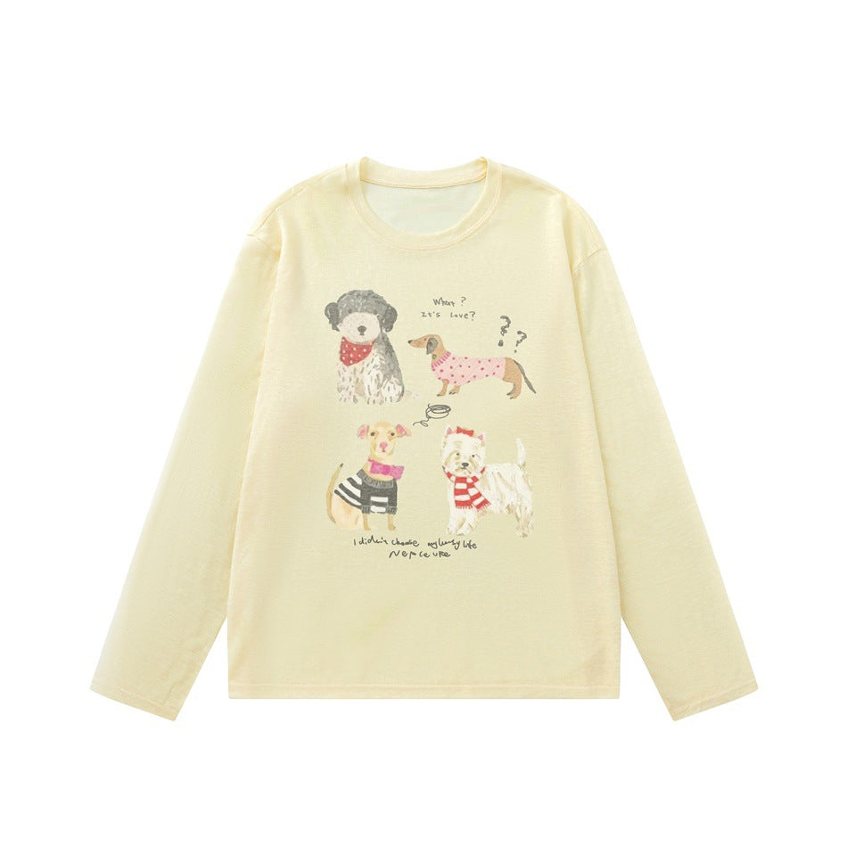 Yellow long-sleeve crew neck top with a watercolor four-dog print on the front, laid flat
