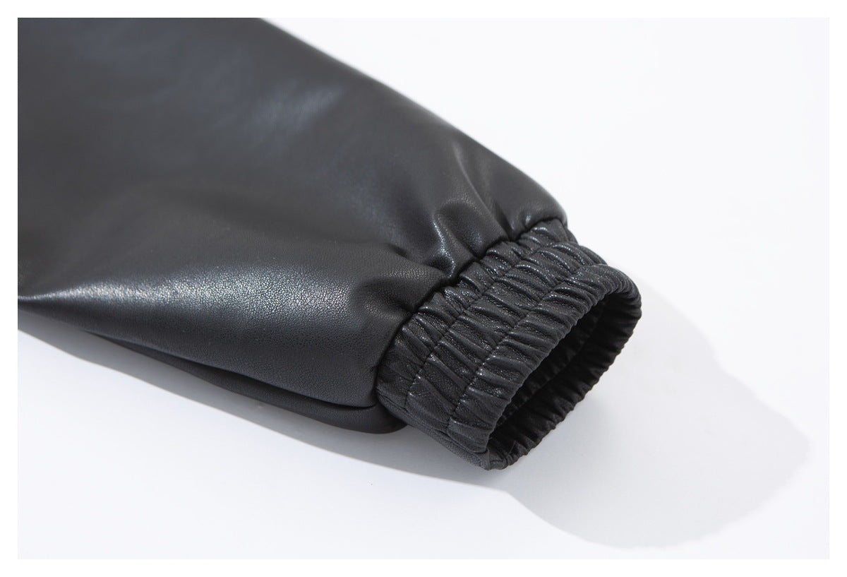 Close-up of the black jacket sleeve ending in a gathered elastic cuff.