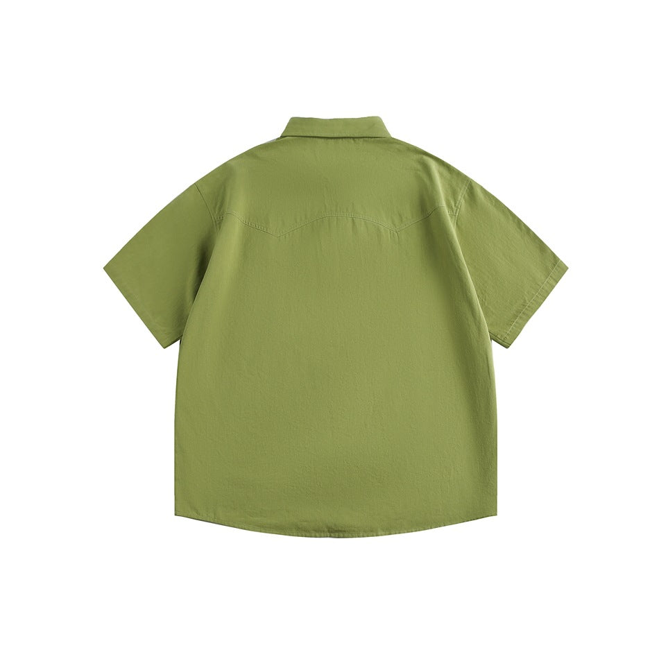 Back view of an olive-green short-sleeve button-up shirt with a curved yoke seam.