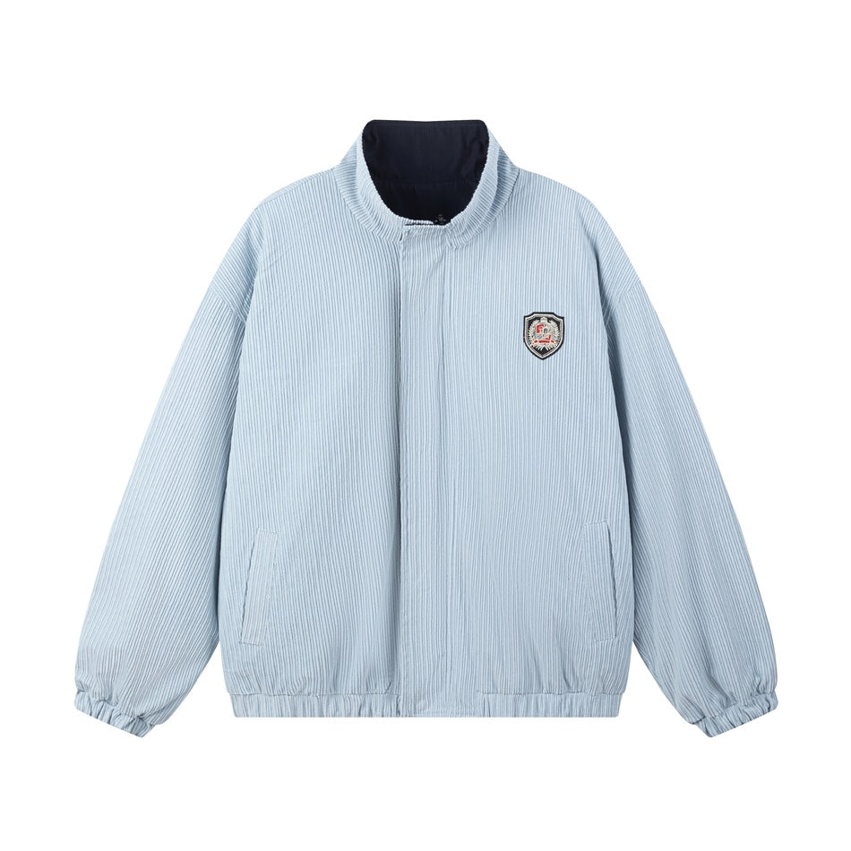 Front view of a light blue pinstriped jacket with a stand collar, front closure, side pockets, and a small shield patch.