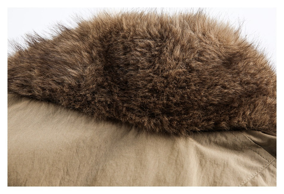 Close-up of a dark brown fur-trimmed edge on a tan garment.