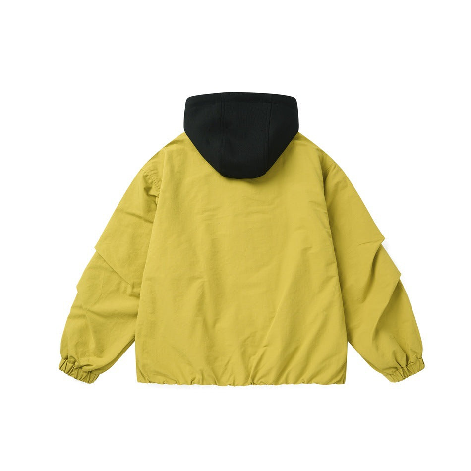 Back view of a yellow jacket with a black hood and gathered elastic cuffs and hem.