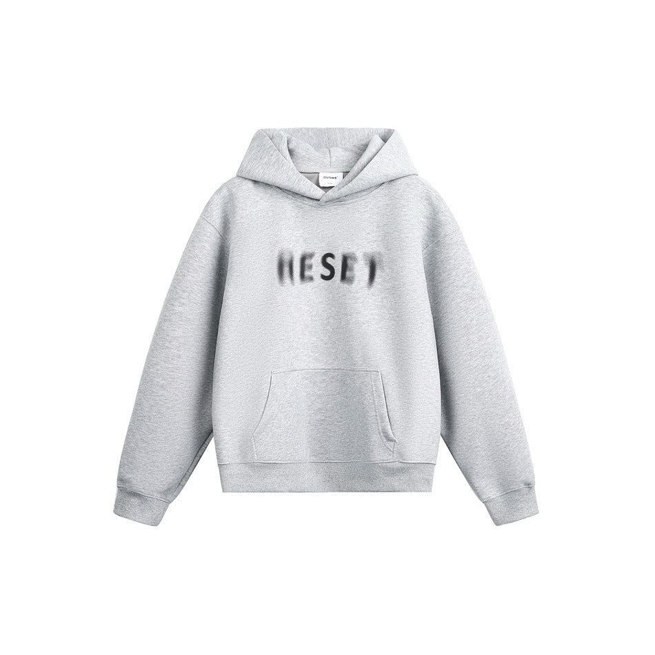 Heather gray pullover hoodie flat lay with blurred RESET chest print and front kangaroo pocket