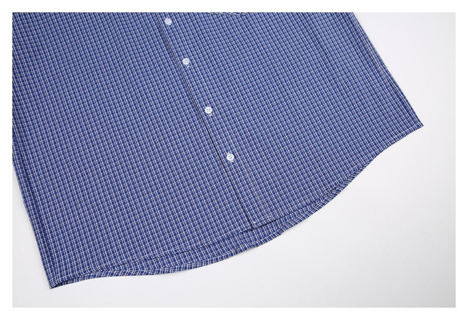 Close-up of the lower front of a blue-and-white checked shirt, showing buttons and curved hem.