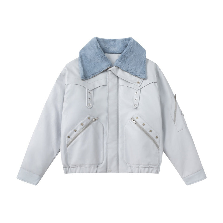 Light gray cropped jacket with blue plush collar, zippered diagonal pockets and stud details, front flat lay