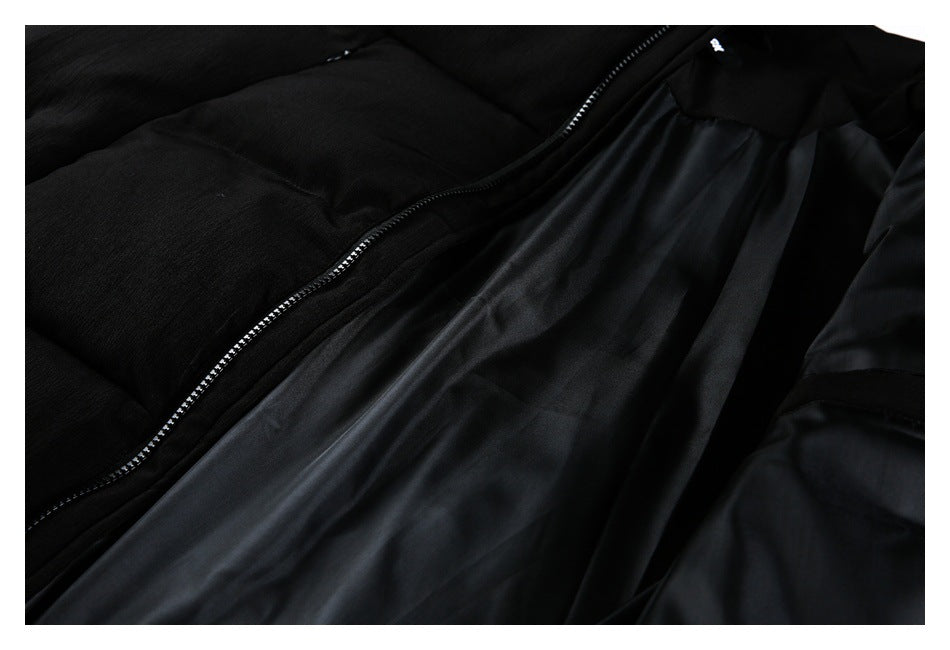 Black garment shown open, with a close view of the front zipper and smooth dark lining.