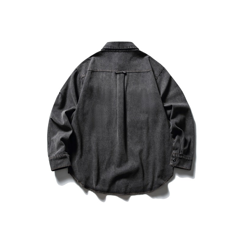 Back view of a charcoal gray denim shirt jacket with a center pleat and rounded hem.