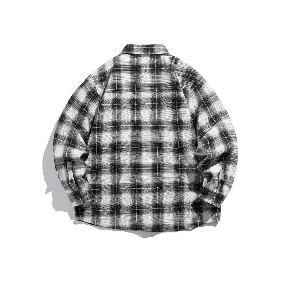 Back view of black and white plaid long-sleeve shirt with crinkled texture, flat lay