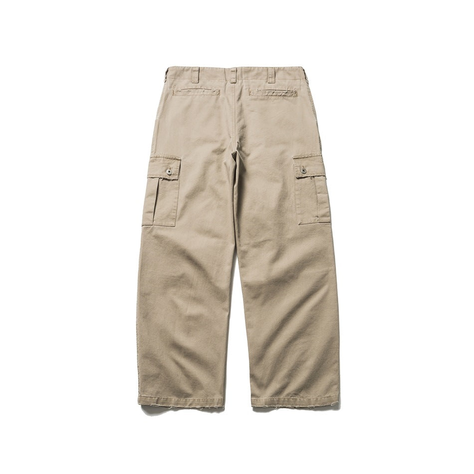 Back view of beige cargo trousers with two rear welt pockets and buttoned side cargo pockets.