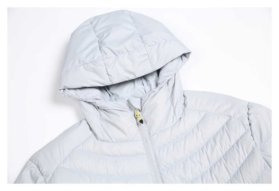 Close-up of a light gray quilted jacket showing its hood, high collar, and front zipper.