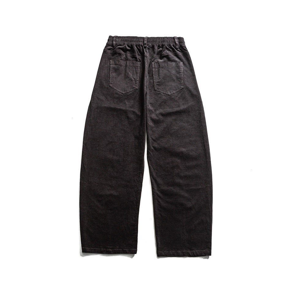 Back view of charcoal relaxed trousers with an elastic waistband and two patch pockets.