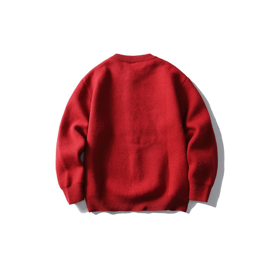 Back view of a red long-sleeve knit sweater with a crew neck and ribbed cuffs and hem.