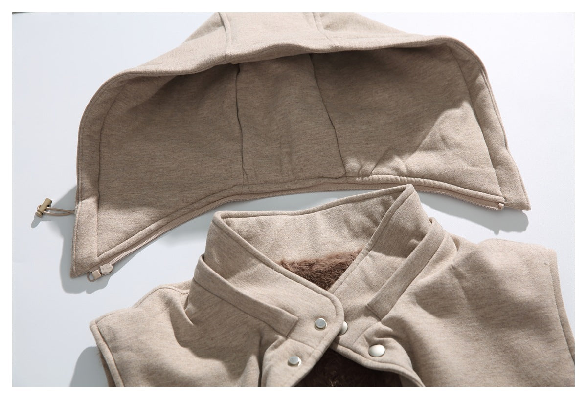 Beige jacket laid flat with its hood spread open above the snap-front collar; brown lining is visible inside.